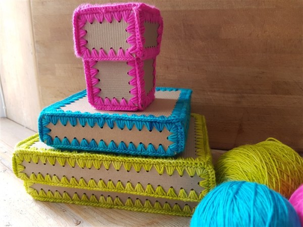 olann-and-spring-awakenigs-crafty-make-crochet-gift-boxes-piled-up-with-yarn-landscape